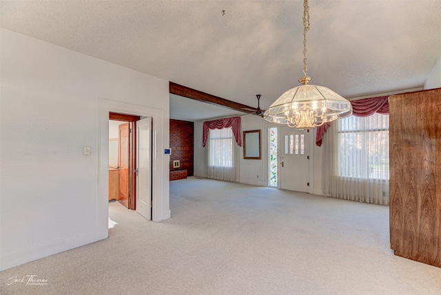 unfurnished room featuring a healthy amount of sunlight and light colored carpet