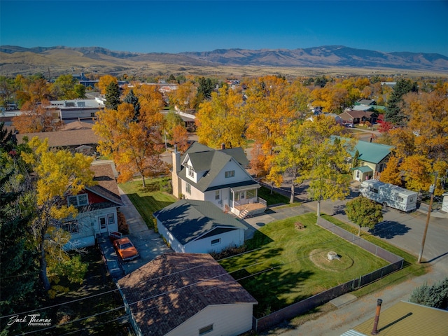 birds eye view of property with a mountain view