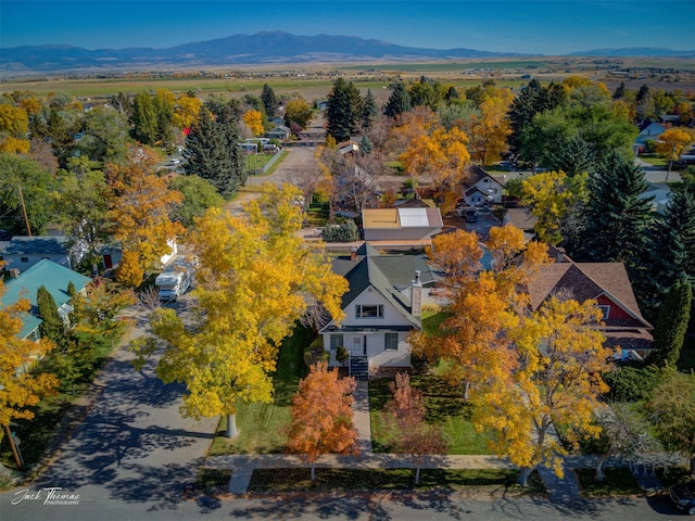 birds eye view of property with a mountain view