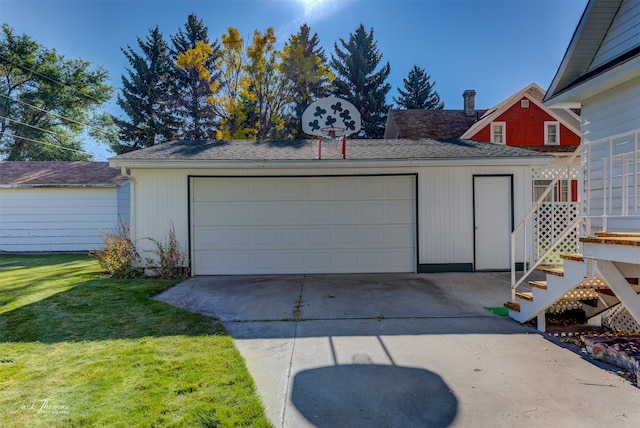 garage featuring a lawn