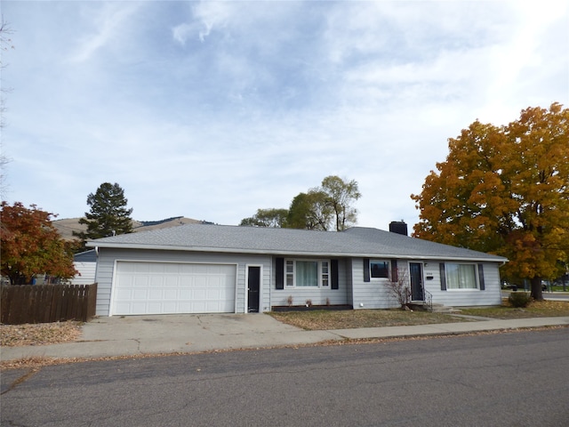 ranch-style home with a garage