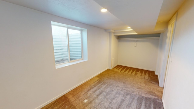 unfurnished bedroom with carpet and a closet