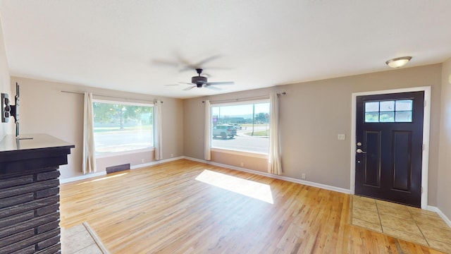 entrance foyer featuring ceiling fan, light hardwood / wood-style flooring, and plenty of natural light