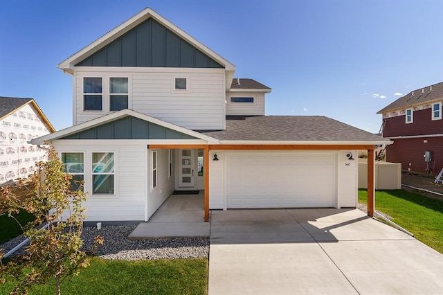 view of front of home with a front yard and a garage