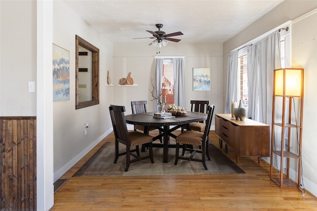 dining space featuring ceiling fan and light hardwood / wood-style floors