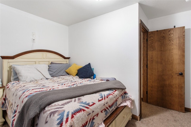 bedroom with light colored carpet