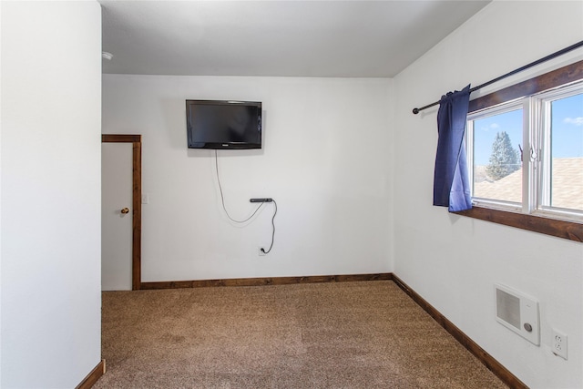 unfurnished room with carpet floors