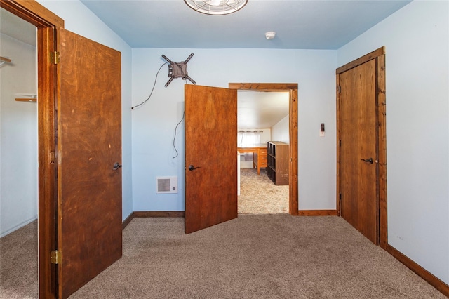 unfurnished bedroom with light carpet