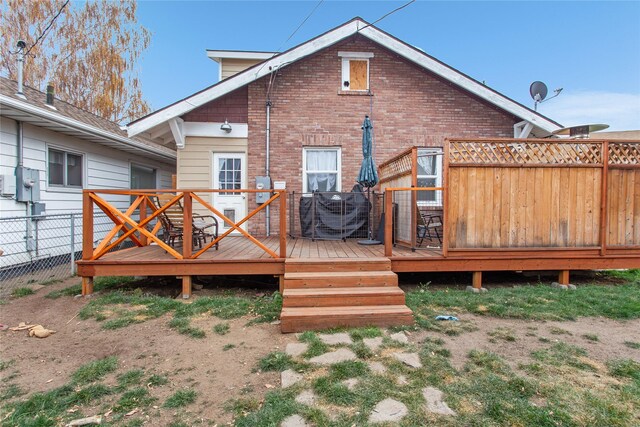 rear view of property with a deck