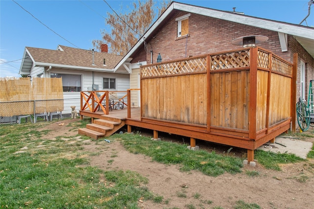 rear view of house with a wooden deck