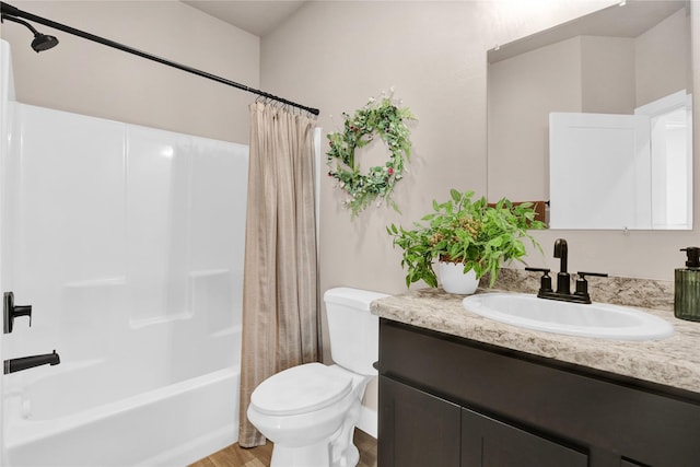 full bathroom with shower / bath combo, vanity, hardwood / wood-style flooring, and toilet