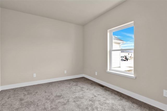 unfurnished room featuring carpet