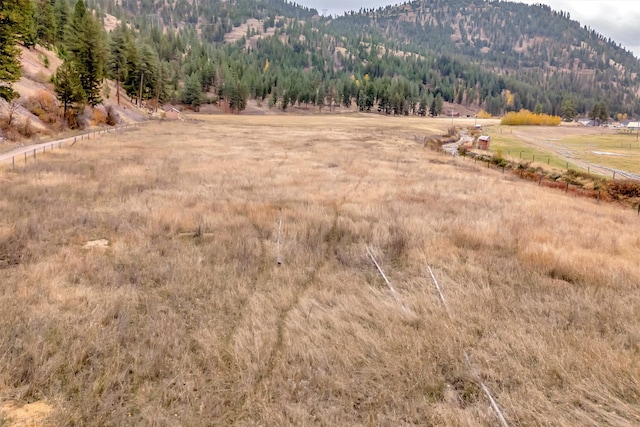 view of mountain feature with a rural view