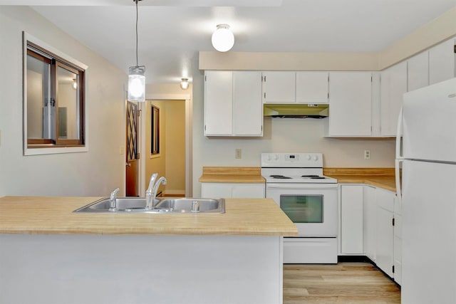 20622 US Highway 10 E, Clinton, MT 59825 - kitchen featuring white appliances, under cabinet range hood, light countertops, white cabinets, and light wood-type flooring