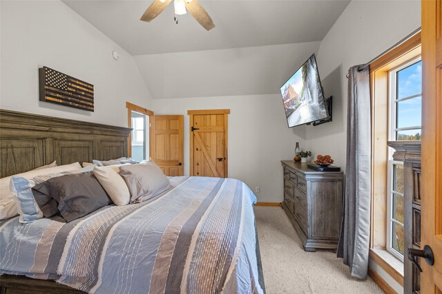 carpeted bedroom with lofted ceiling and ceiling fan