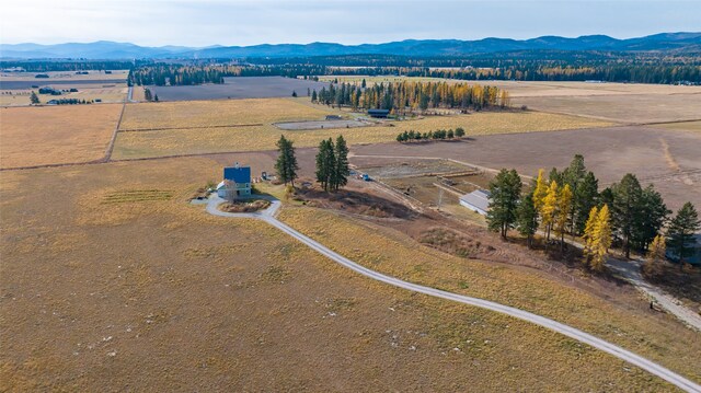 drone / aerial view with a mountain view and a rural view