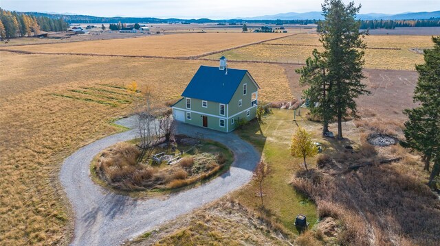 bird's eye view with a mountain view and a rural view