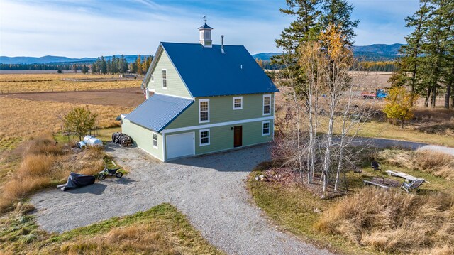 exterior space with a mountain view and a rural view