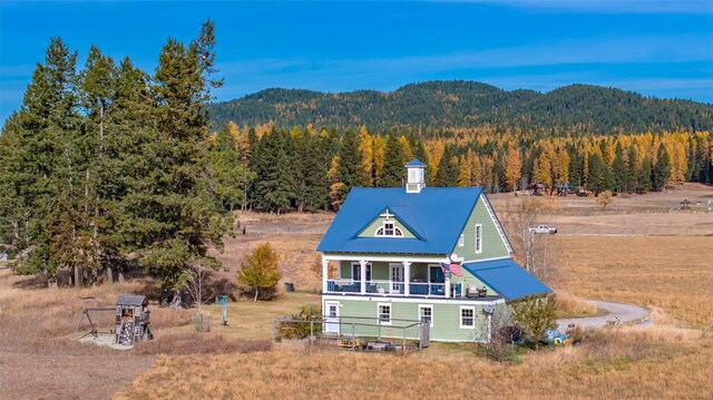 exterior space featuring a mountain view and covered porch