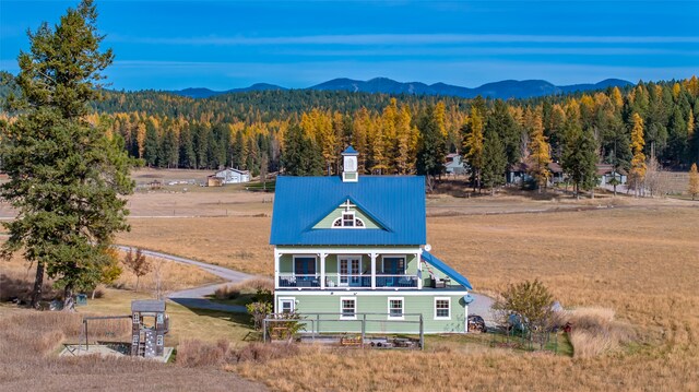 birds eye view of property featuring a mountain view