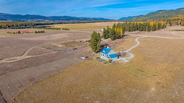 drone / aerial view with a mountain view and a rural view