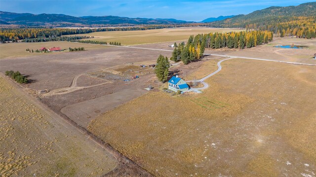 drone / aerial view featuring a mountain view