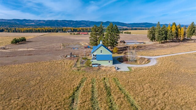 bird's eye view with a mountain view and a rural view