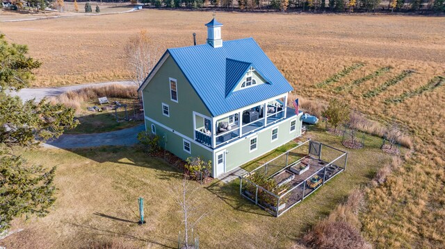 birds eye view of property with a rural view