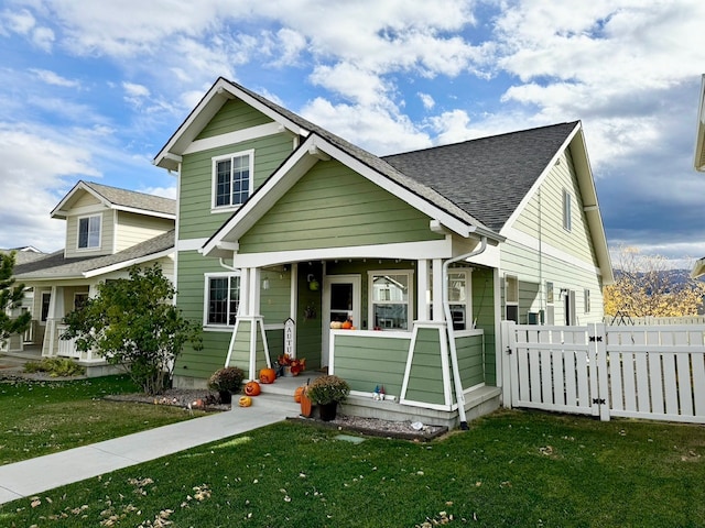 craftsman house featuring a front lawn and covered porch