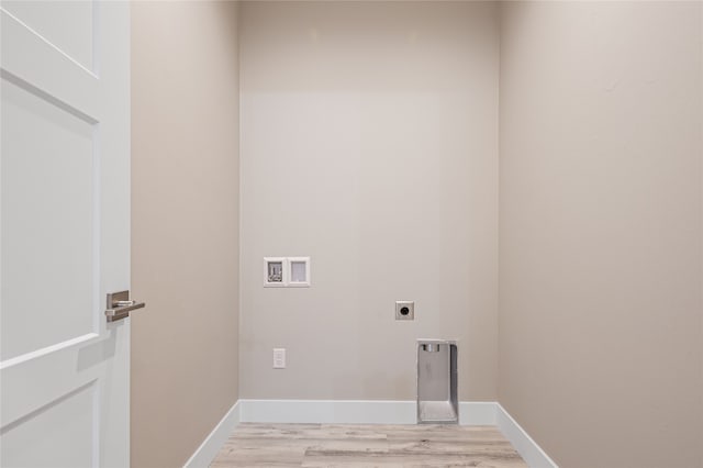 laundry room with hookup for an electric dryer, hookup for a washing machine, and light wood-type flooring