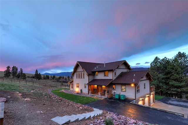 view of front of house with a mountain view and a garage