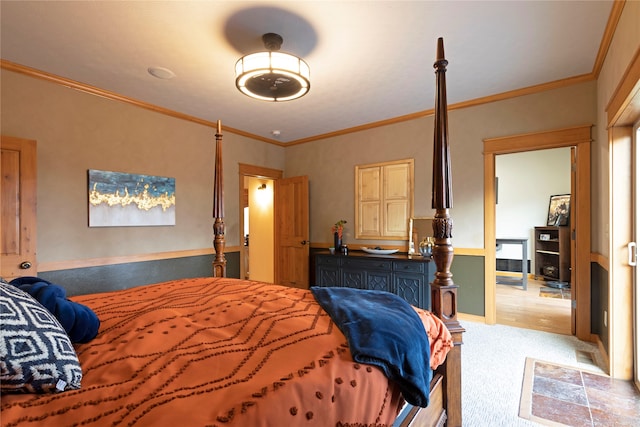 bedroom featuring crown molding and light colored carpet