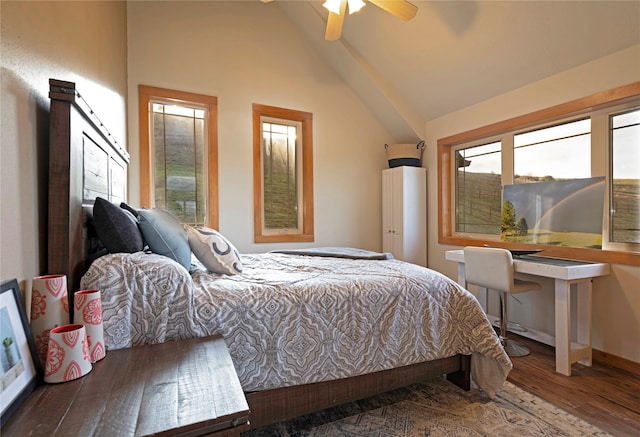 bedroom featuring hardwood / wood-style floors, ceiling fan, and vaulted ceiling