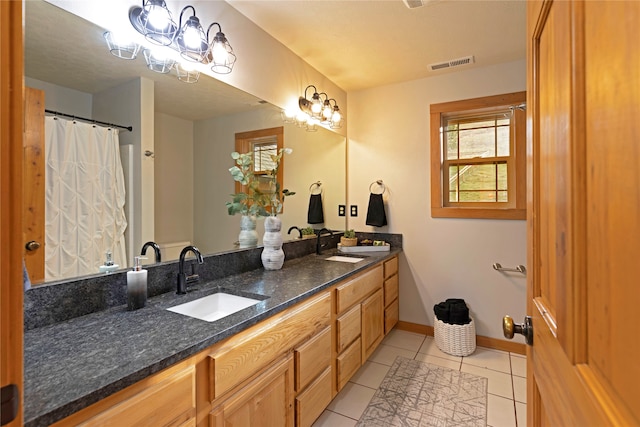 bathroom with vanity and tile patterned floors