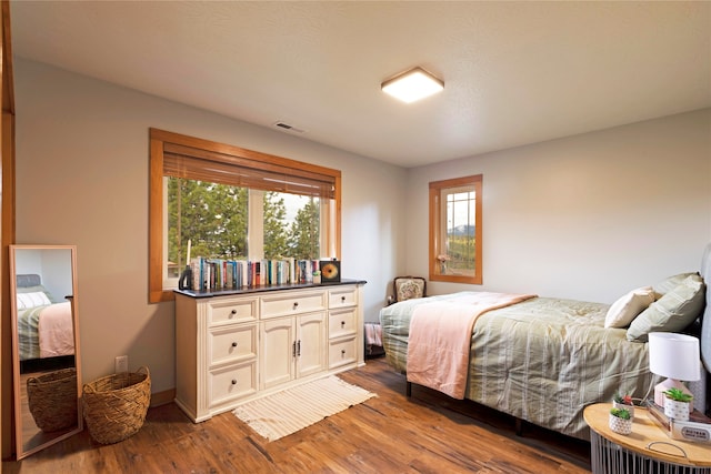 bedroom featuring hardwood / wood-style flooring