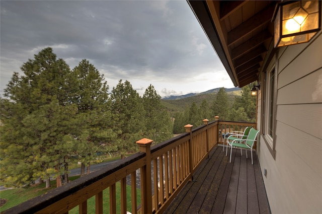 wooden terrace featuring a mountain view