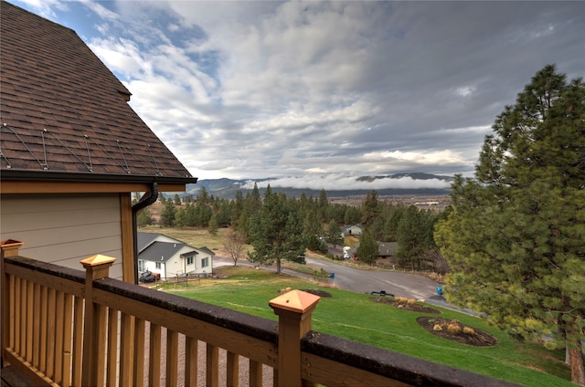 exterior space featuring a mountain view and a yard