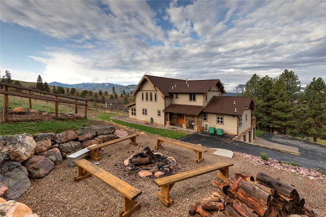 back of property with a mountain view