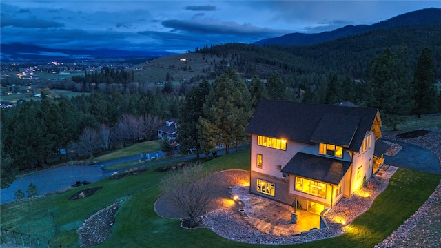 aerial view at dusk with a mountain view