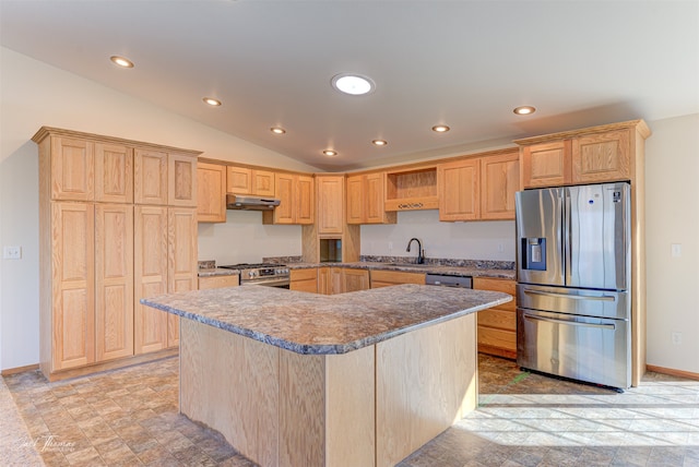 kitchen with light brown cabinetry, sink, a kitchen island, stainless steel appliances, and vaulted ceiling