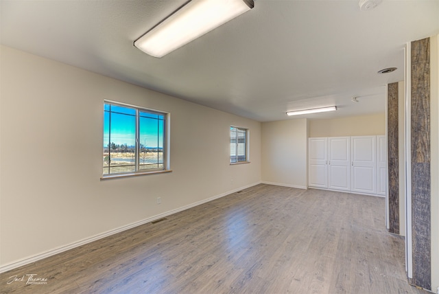 spare room featuring light hardwood / wood-style flooring