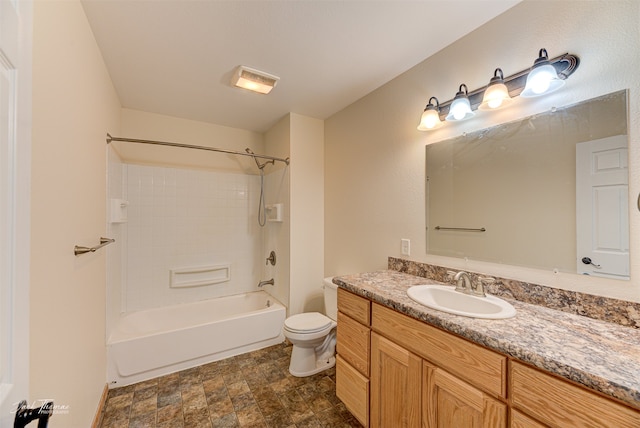 full bathroom featuring vanity, toilet, and tiled shower / bath