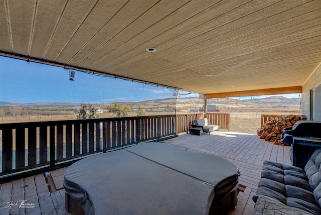 wooden deck with a mountain view