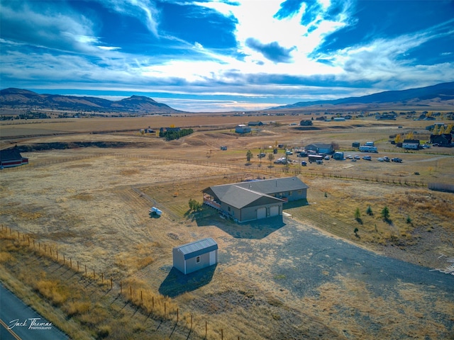 drone / aerial view with a mountain view and a rural view