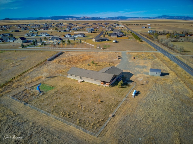 drone / aerial view featuring a mountain view