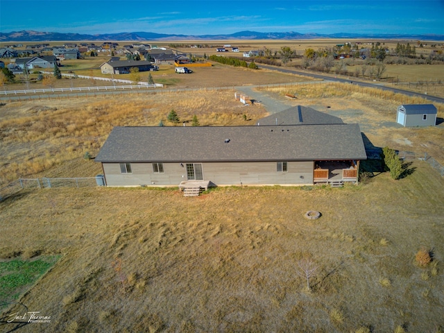 drone / aerial view with a mountain view and a rural view