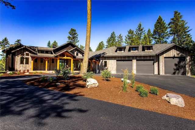 modern farmhouse style home featuring a garage