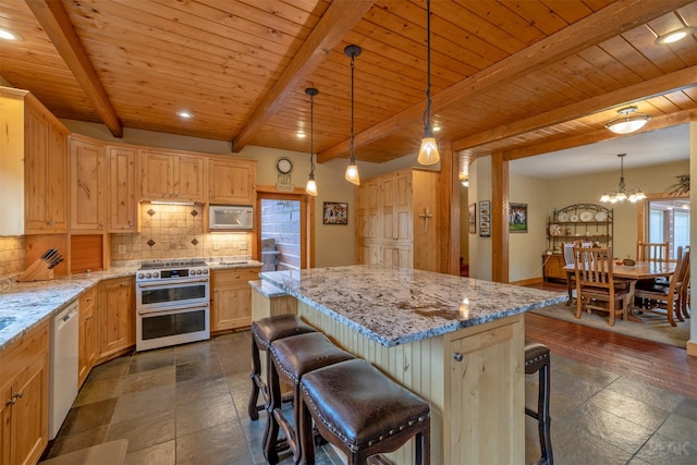 214 Solomon Mountain Rd, Clancy, MT 59634 - kitchen with double oven range, white microwave, decorative backsplash, dishwashing machine, and a wood ceiling with exposed beams