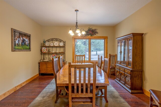 214 Solomon Mountain Rd, Clancy, MT 59634 - dining room with a chandelier and dark wood-type flooring