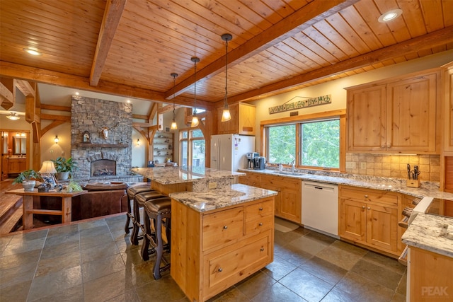 214 Solomon Mountain Rd, Clancy, MT 59634 - kitchen with white appliances, a wood ceiling with exposed beams, decorative backsplash, a fireplace, and a center island